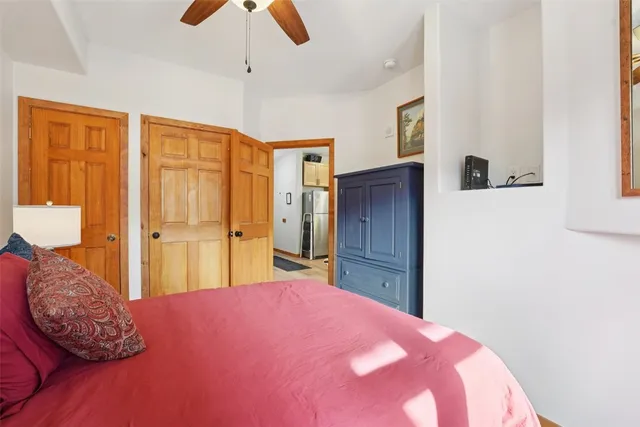 a bedroom with a bed and a dresser