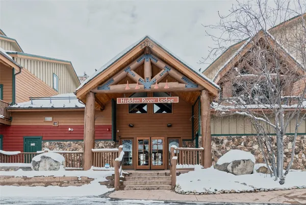 a front view of a house with a dirt road
