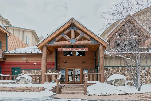 a front view of a house with a dirt road