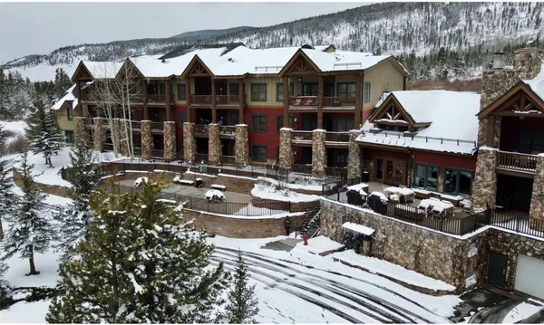 a front view of a house with sitting area