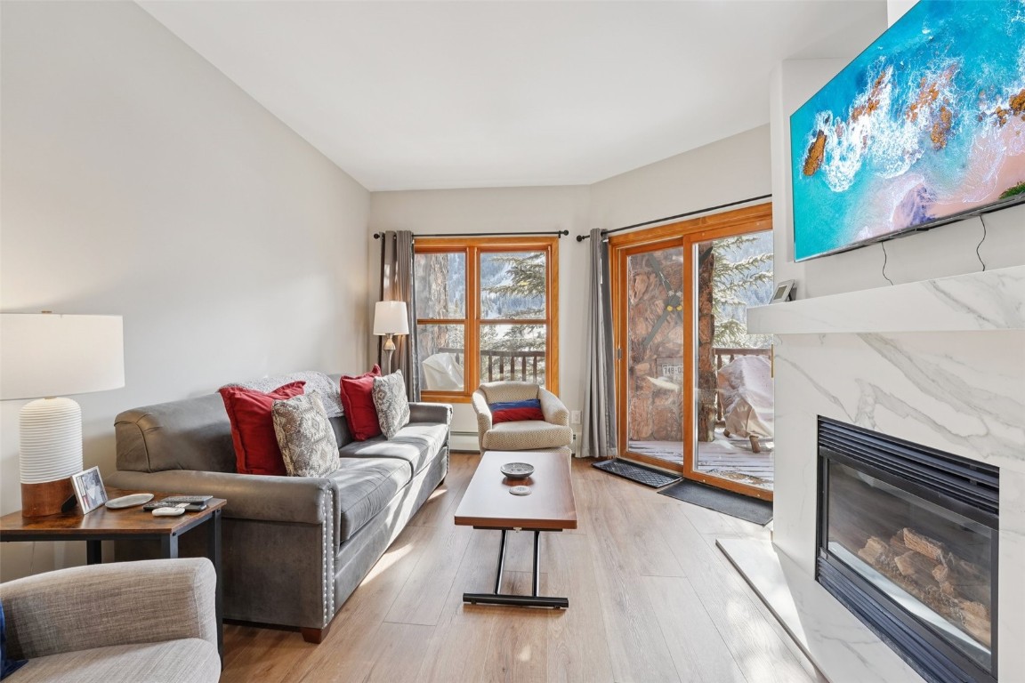 22714 Highway 6, Unit 5971 Keystone, CO 80435 - Photo 3 of 21 a living room with furniture and a fireplace