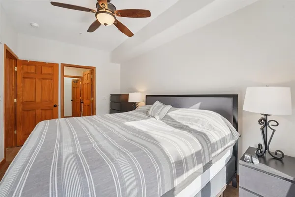 a bedroom with a bed and closet