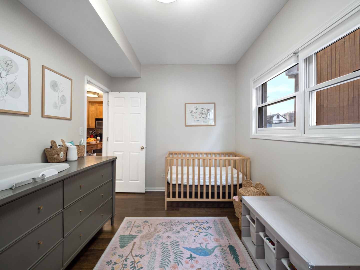 1531 West Walton Street, Unit 1 Chicago, IL 60642 - Photo 15 of 20 a bedroom with a bed and wooden floor