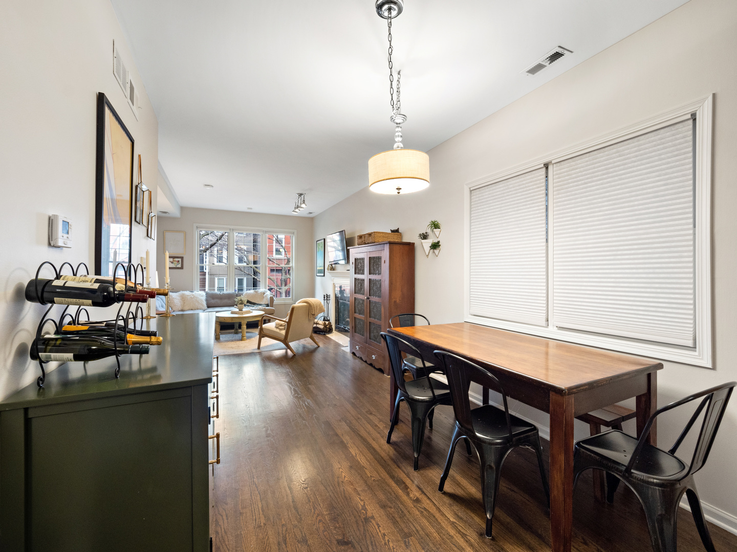 1531 West Walton Street, Unit 1 Chicago, IL 60642 - Photo 3 of 20 a view of a dining room and livingroom with furniture wooden floor a chandelier