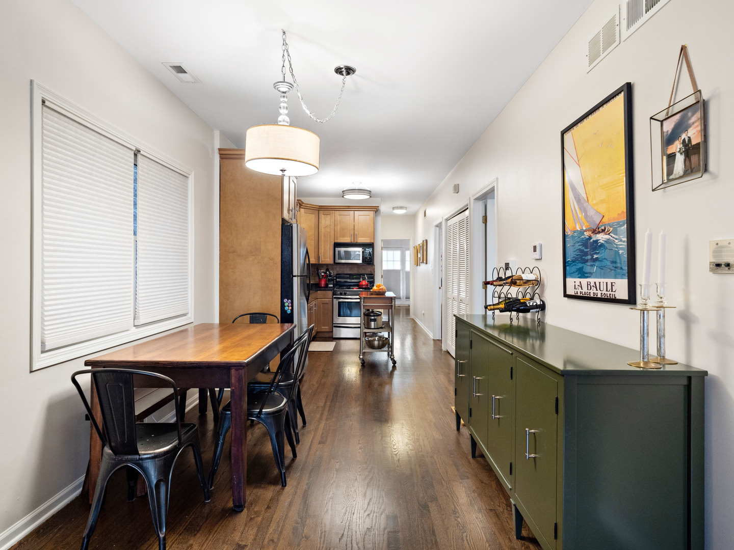 1531 West Walton Street, Unit 1 Chicago, IL 60642 - Photo 5 of 20 a view of a dining room with furniture and wooden floor