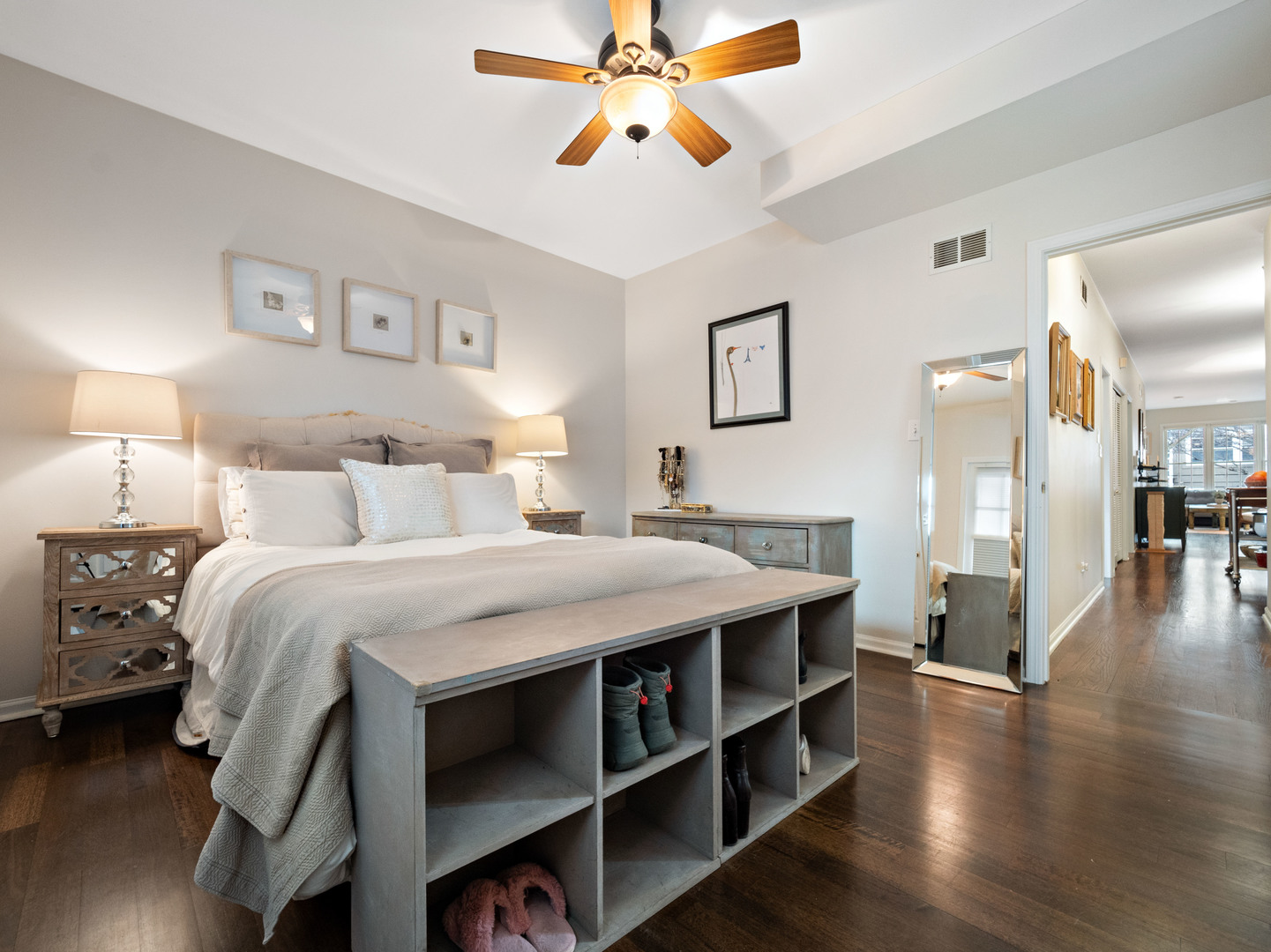 1531 West Walton Street, Unit 1 Chicago, IL 60642 - Photo 10 of 20 a bedroom with a bed and a chandelier