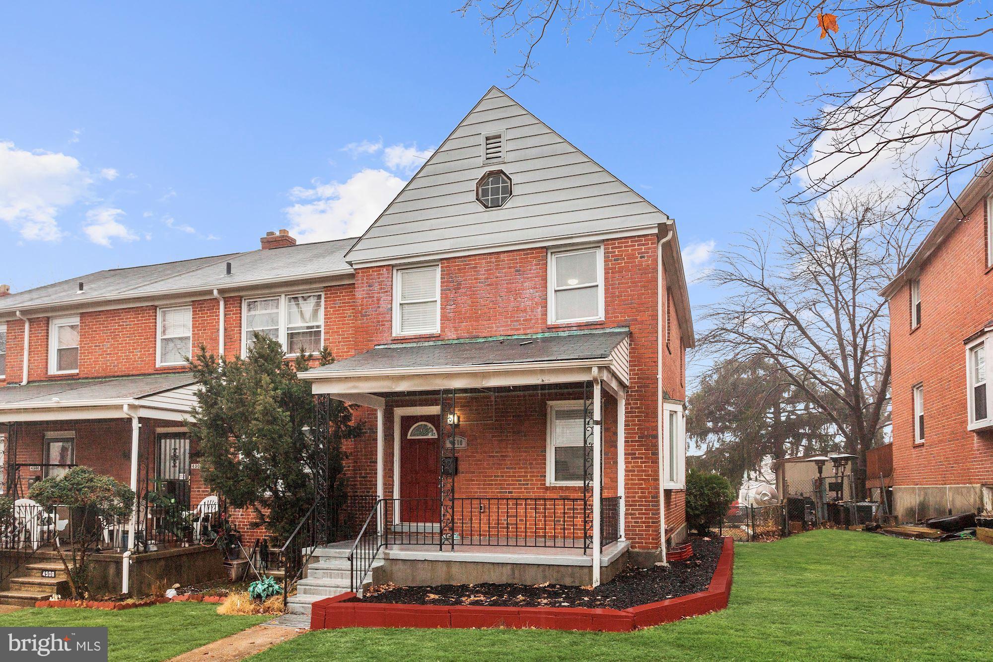 4510 Marble Hall Road Baltimore, MD 21239 - Photo 1 of 24 a front view of a house with garden