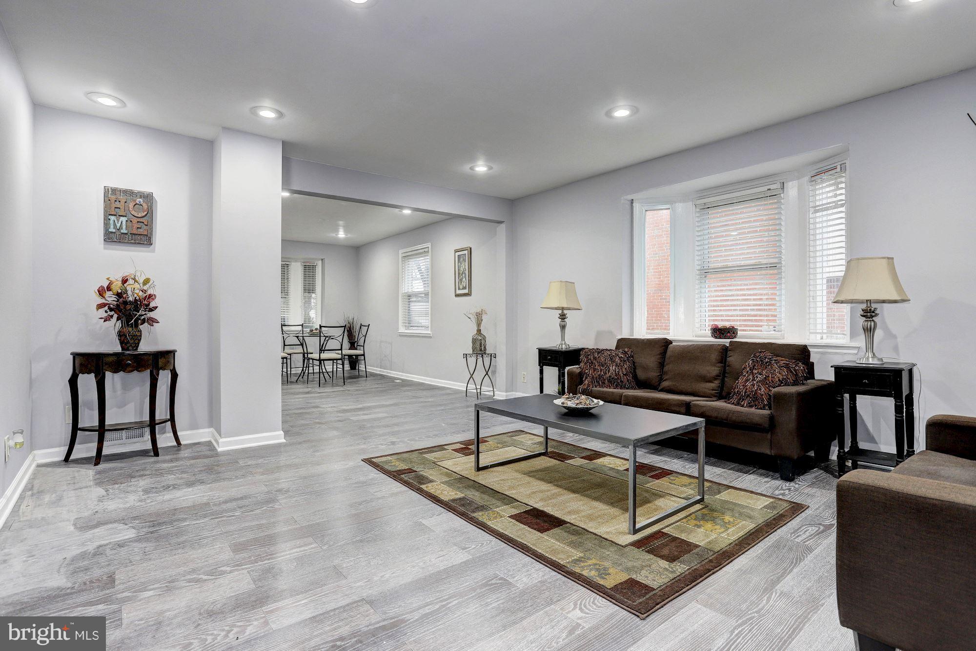 4510 Marble Hall Road Baltimore, MD 21239 - Photo 2 of 24 a living room with furniture a rug and a window