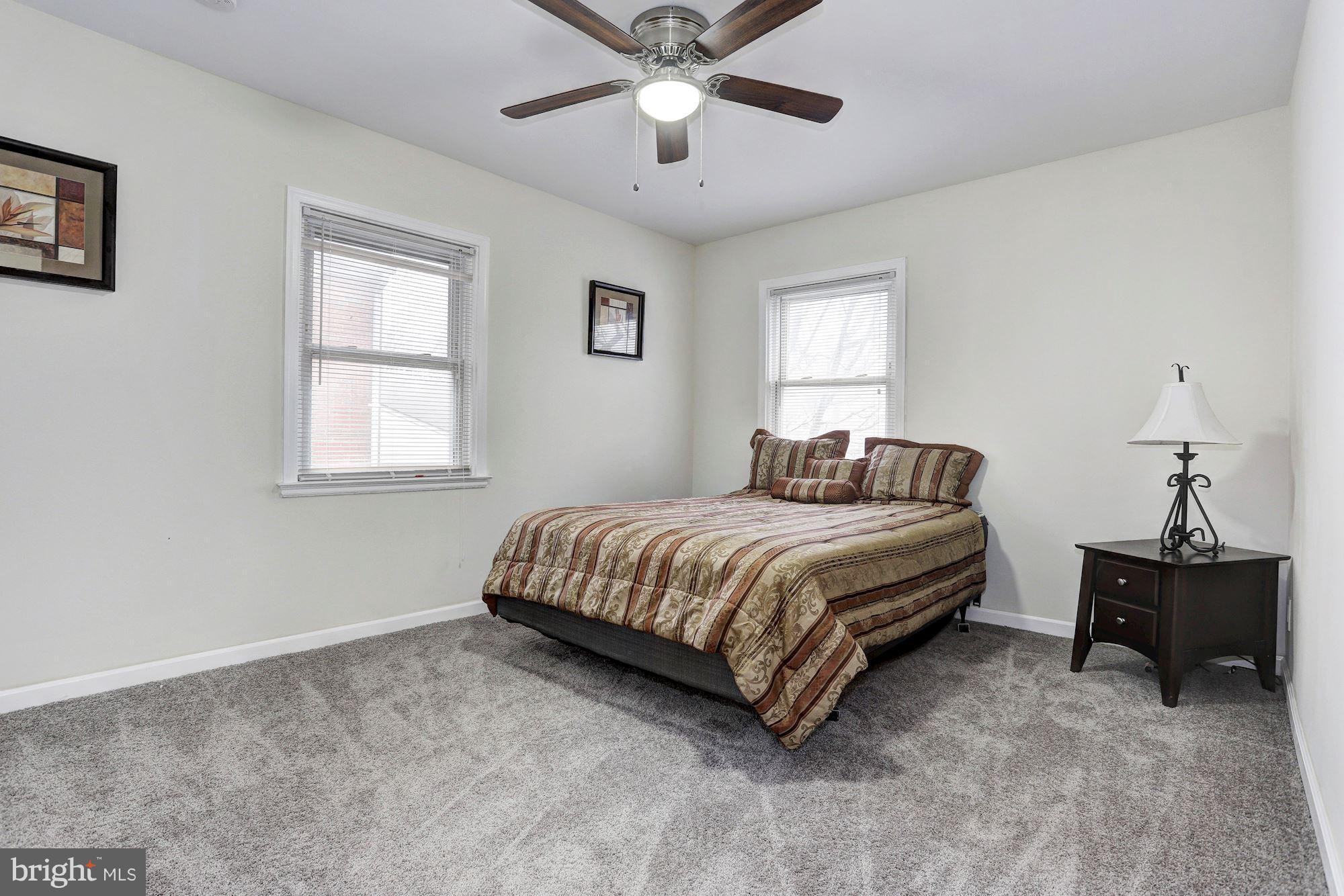 4510 Marble Hall Road Baltimore, MD 21239 - Photo 12 of 24 a bedroom with a bed and window