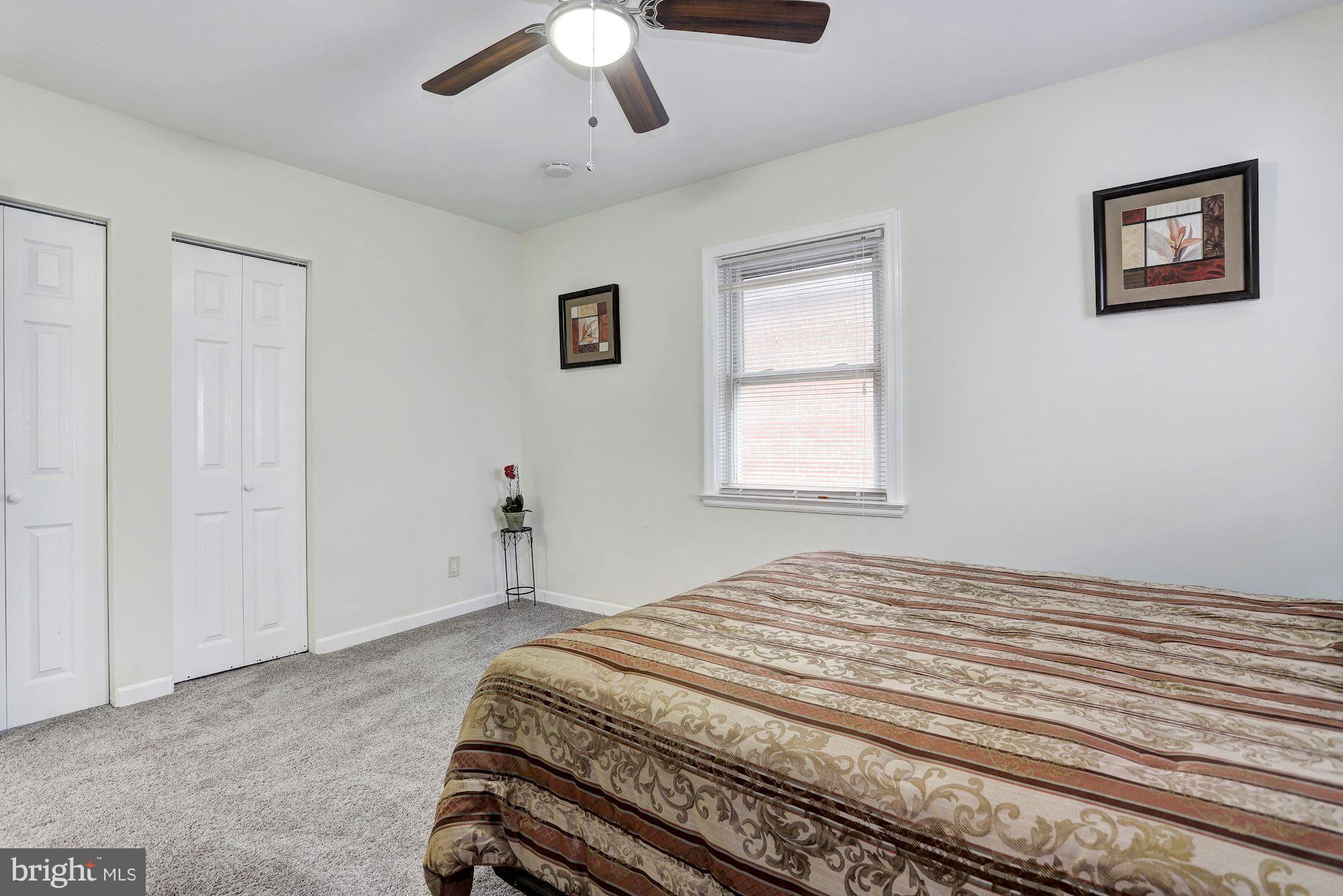 4510 Marble Hall Road Baltimore, MD 21239 - Photo 13 of 24 a bedroom with a bed and a window