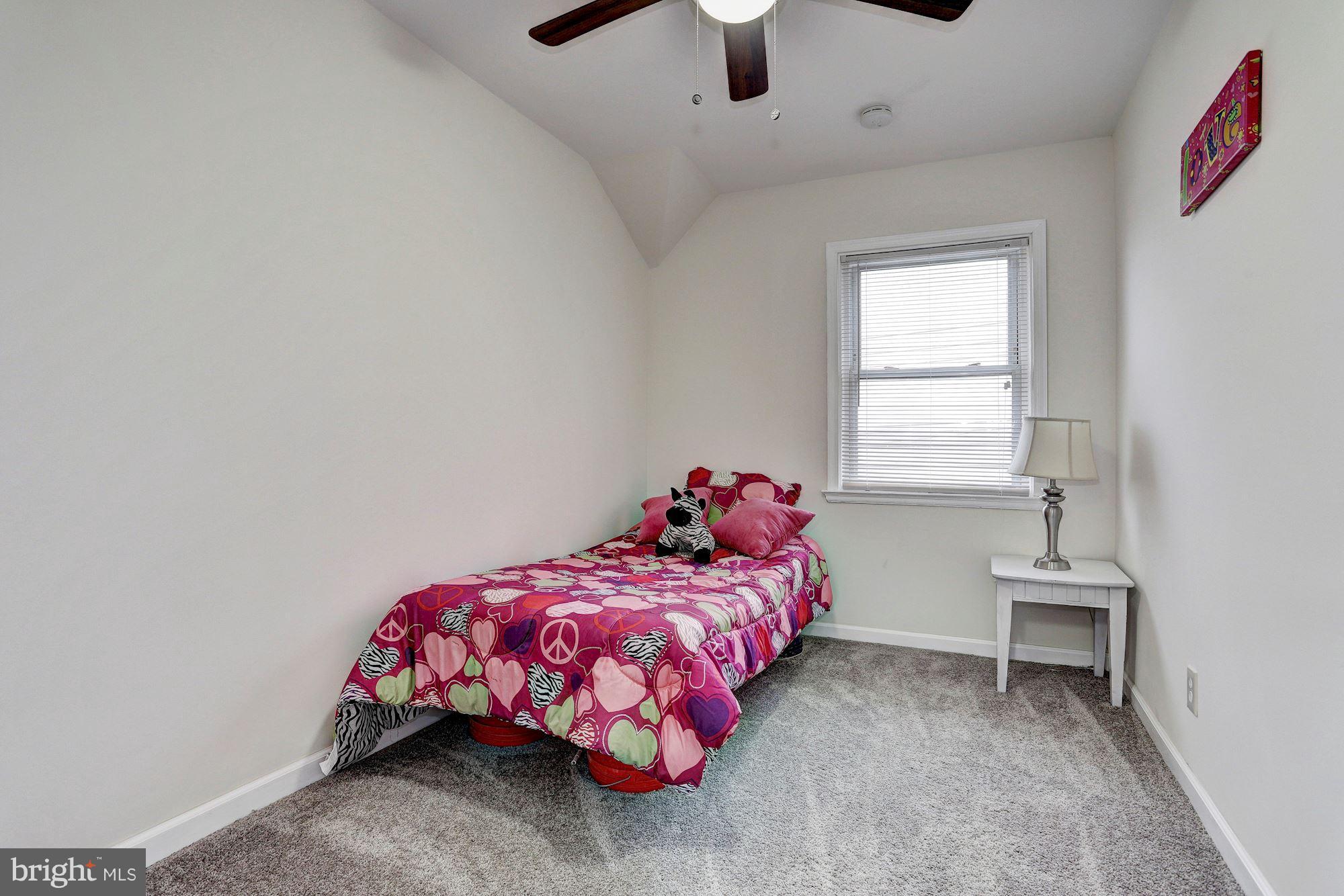 4510 Marble Hall Road Baltimore, MD 21239 - Photo 15 of 24 a bedroom with a bed and a window