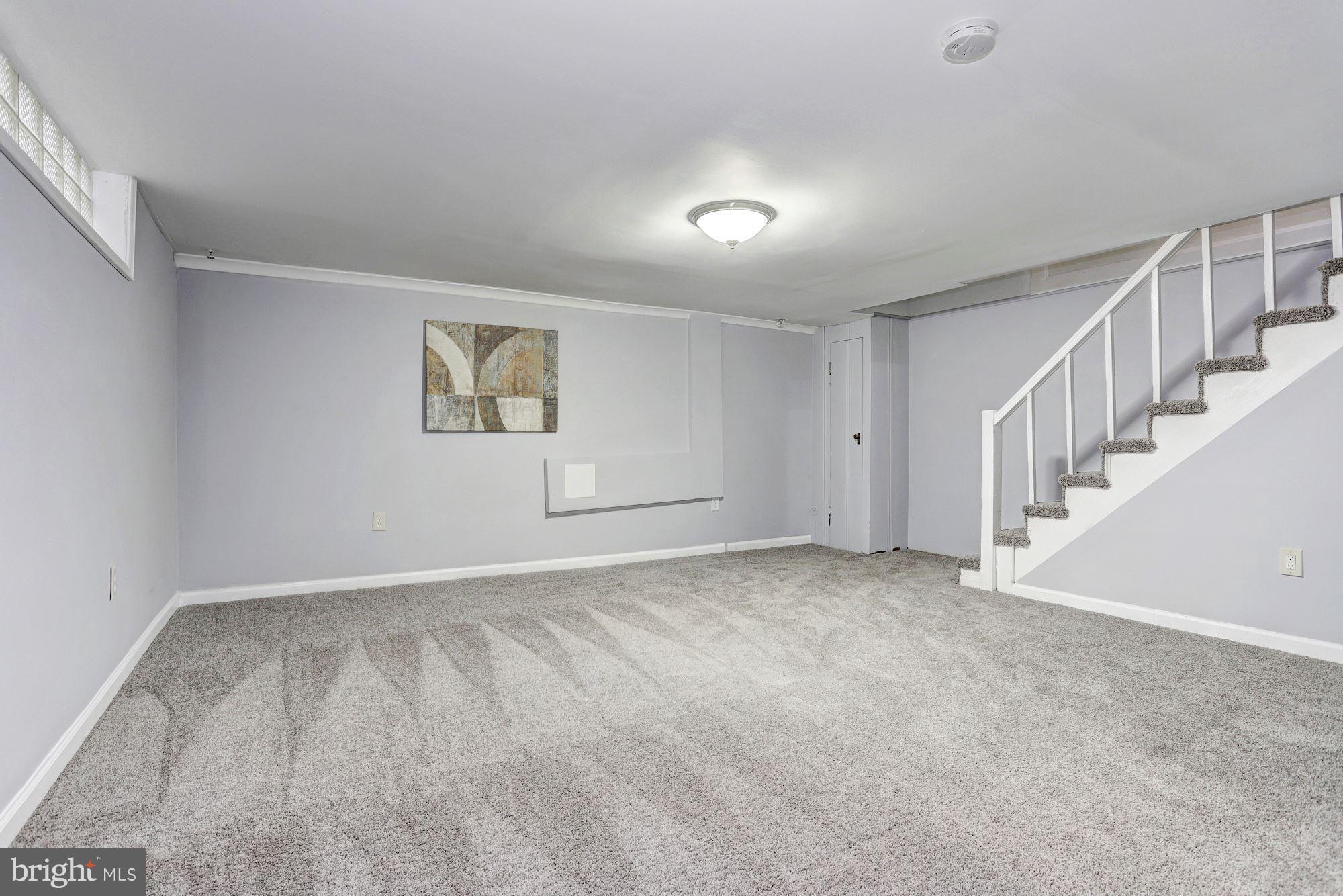 4510 Marble Hall Road Baltimore, MD 21239 - Photo 18 of 24 a view of an empty room with wooden floor