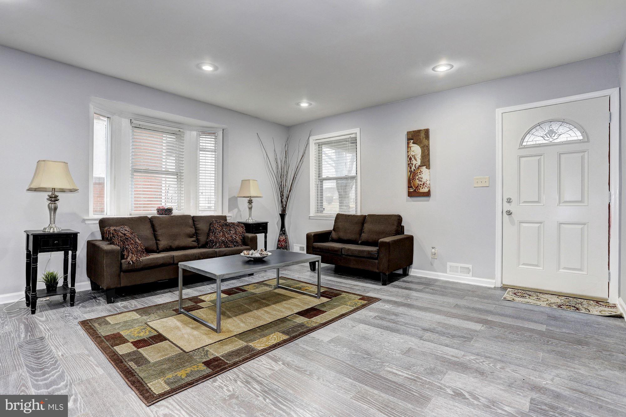 4510 Marble Hall Road Baltimore, MD 21239 - Photo 3 of 24 a living room with furniture a rug and a window