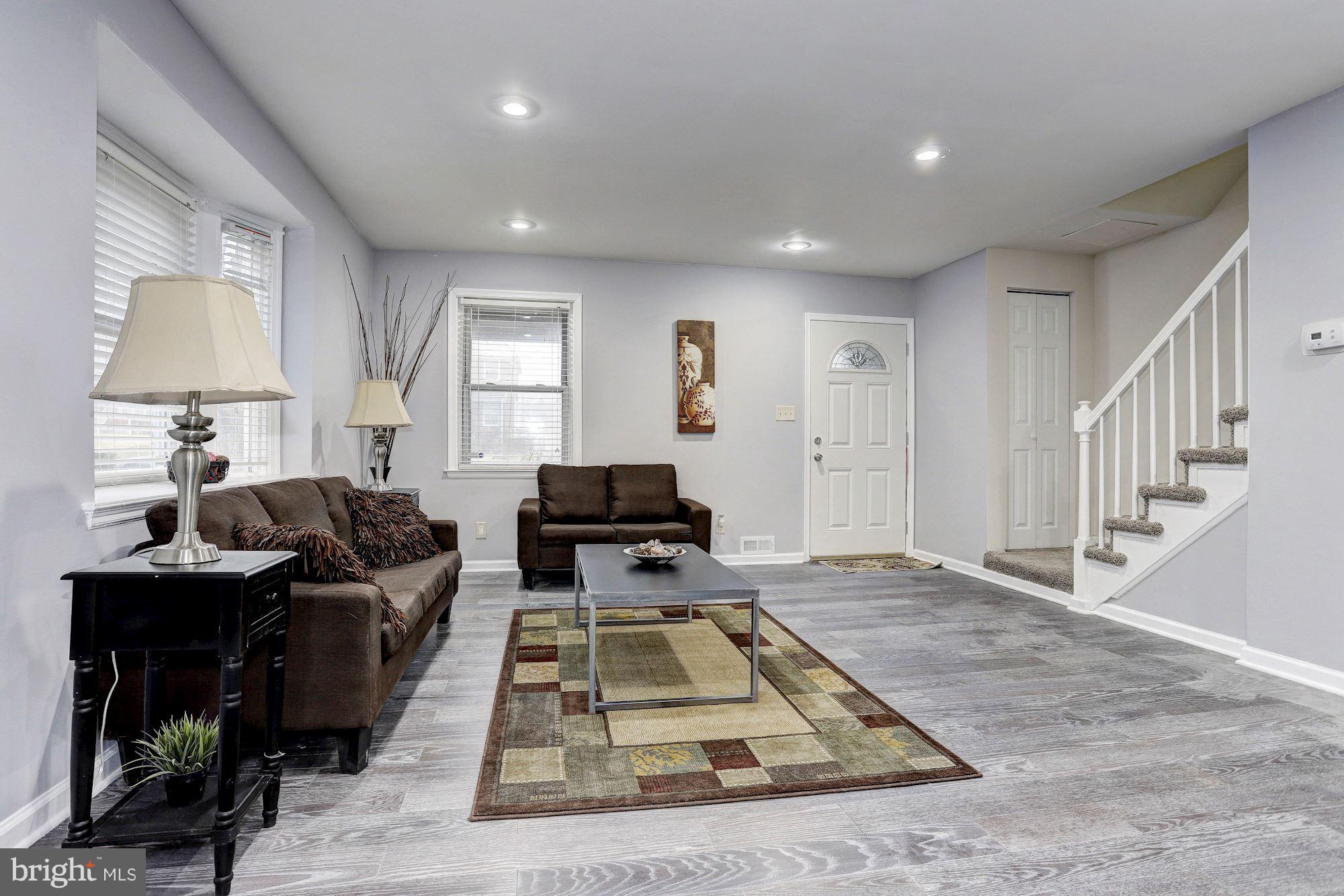 4510 Marble Hall Road Baltimore, MD 21239 - Photo 4 of 24 a living room with furniture and a table