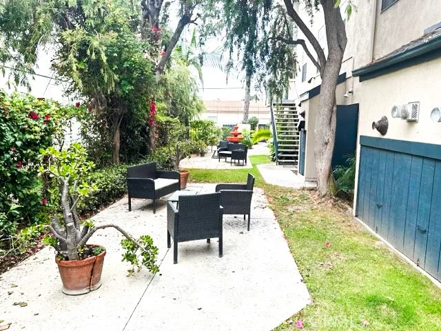 a view of a backyard with sitting area