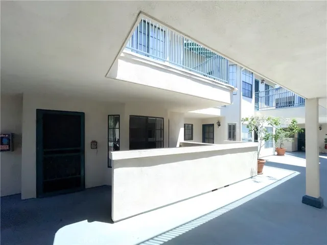a view of living room with furniture and a chandelier