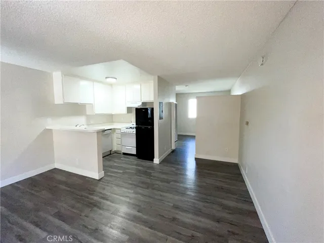a view of kitchen with wooden floor