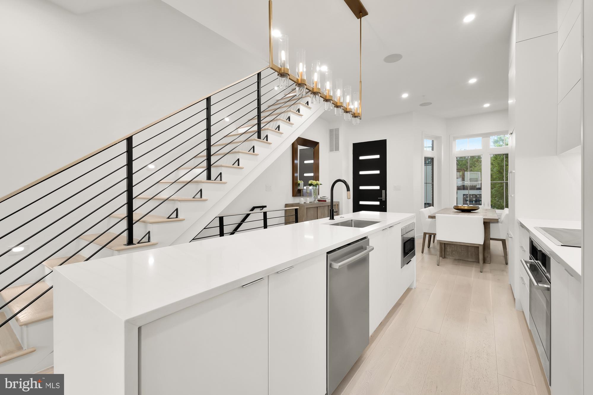 146 S Street Northwest, Unit B Washington, DC 20001 - Photo 14 of 51 a large white kitchen with a large window