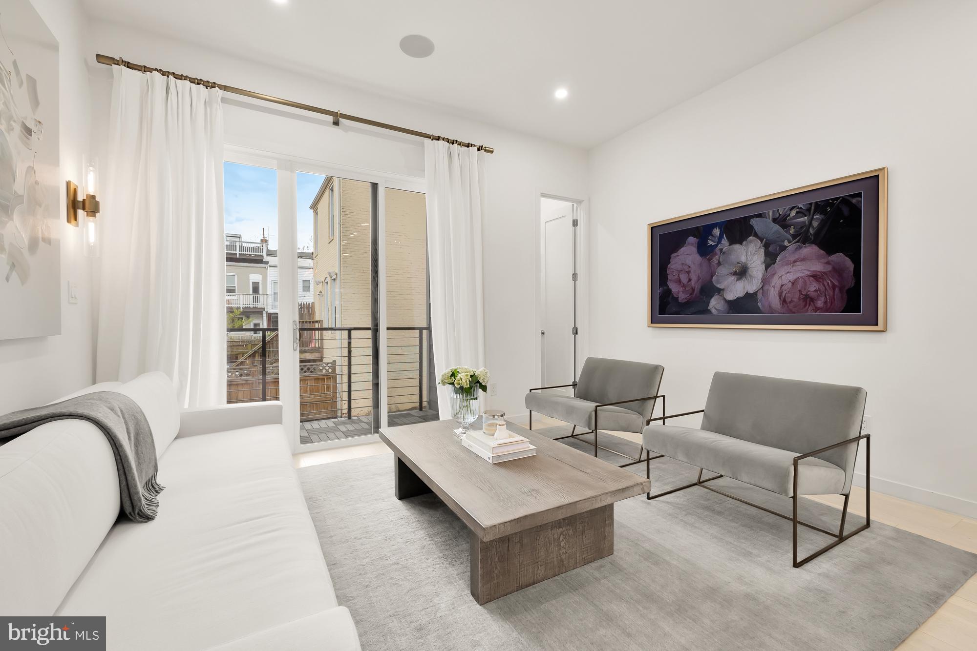 146 S Street Northwest, Unit B Washington, DC 20001 - Photo 16 of 51 a living room with furniture a large window and a table