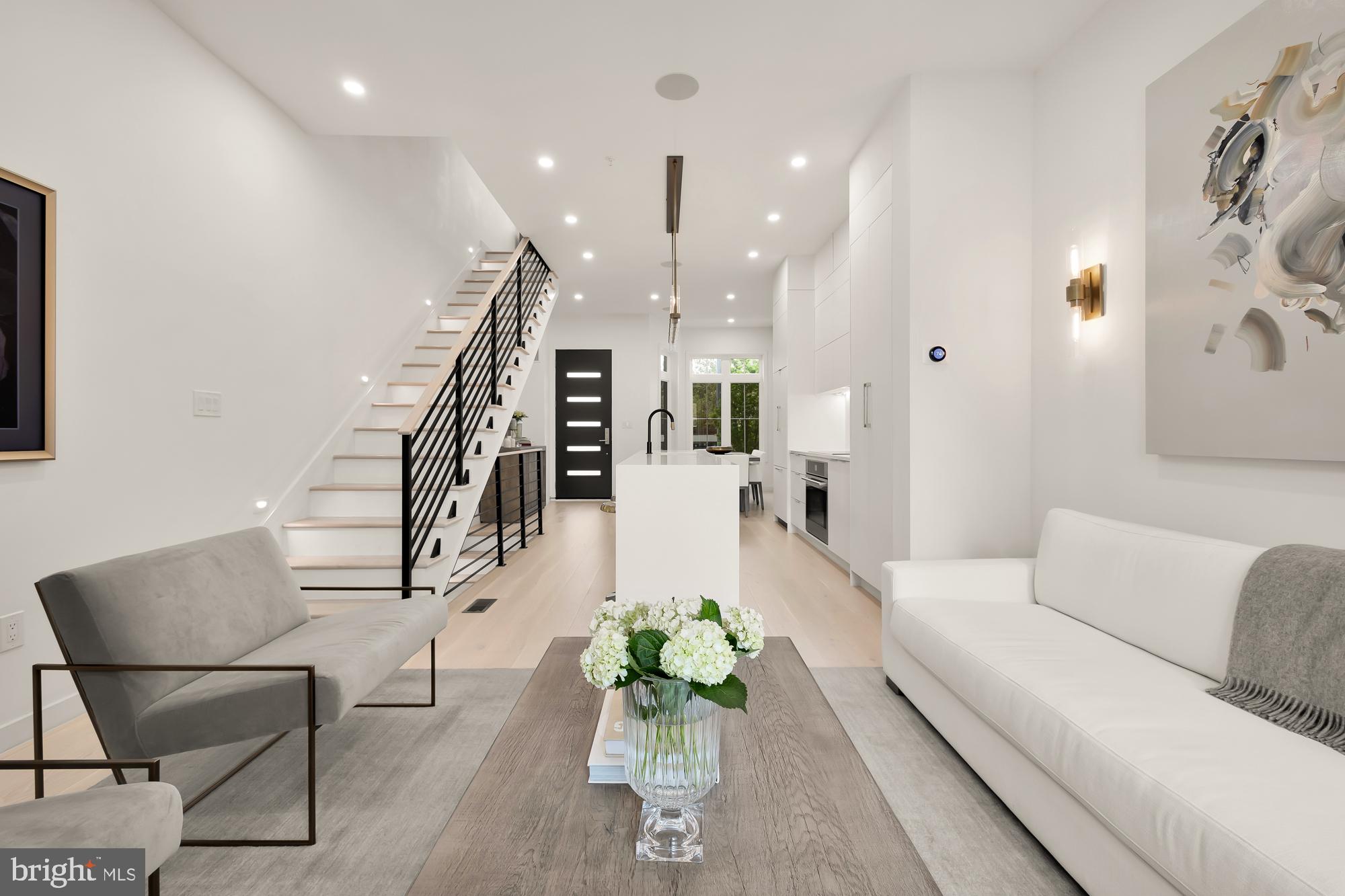 146 S Street Northwest, Unit B Washington, DC 20001 - Photo 19 of 51 a living room with furniture and a chandelier
