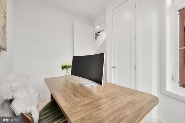 a large white bed in a white room