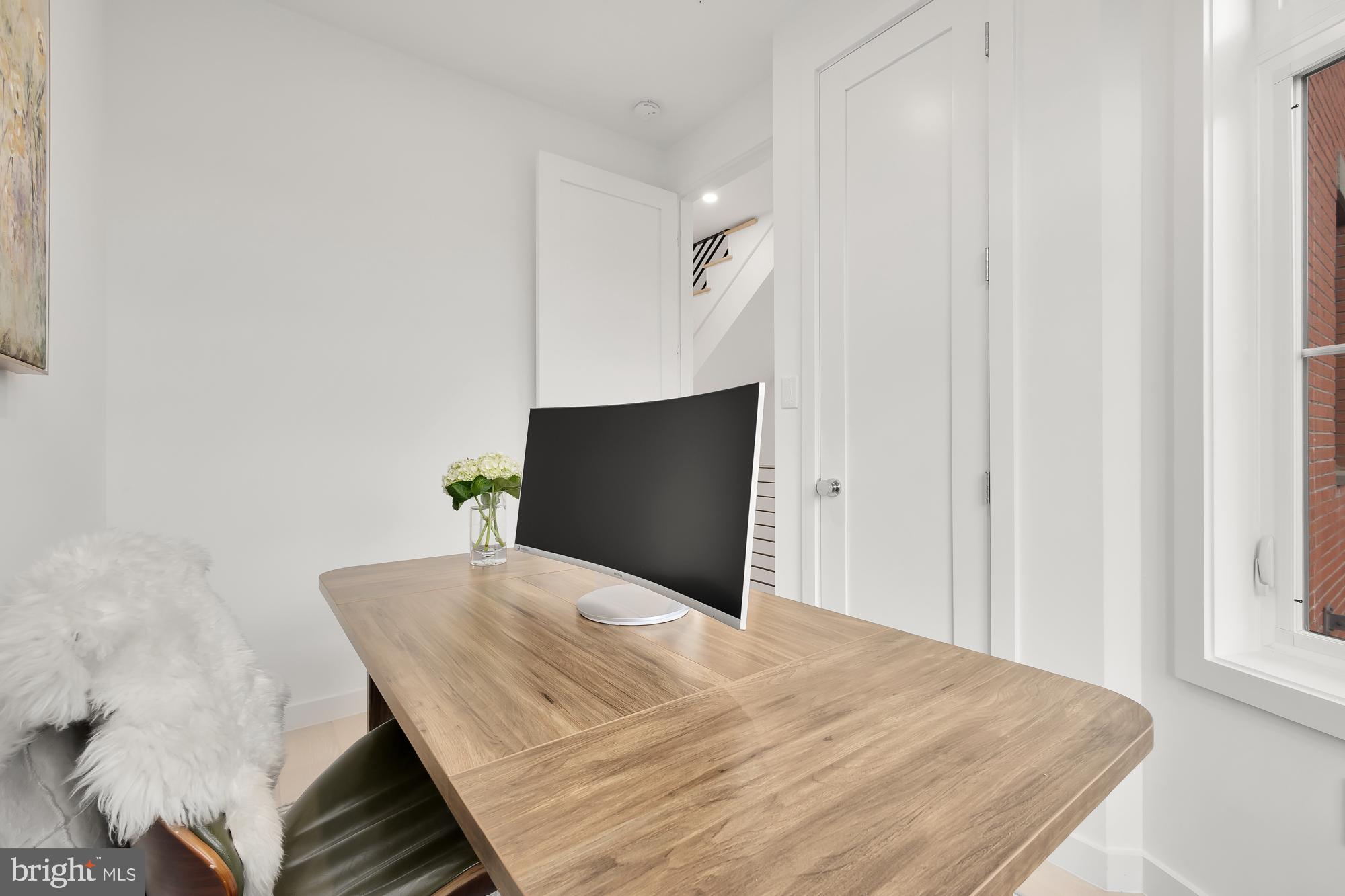146 S Street Northwest, Unit B Washington, DC 20001 - Photo 25 of 51 a bedroom with a bed and a flat screen tv