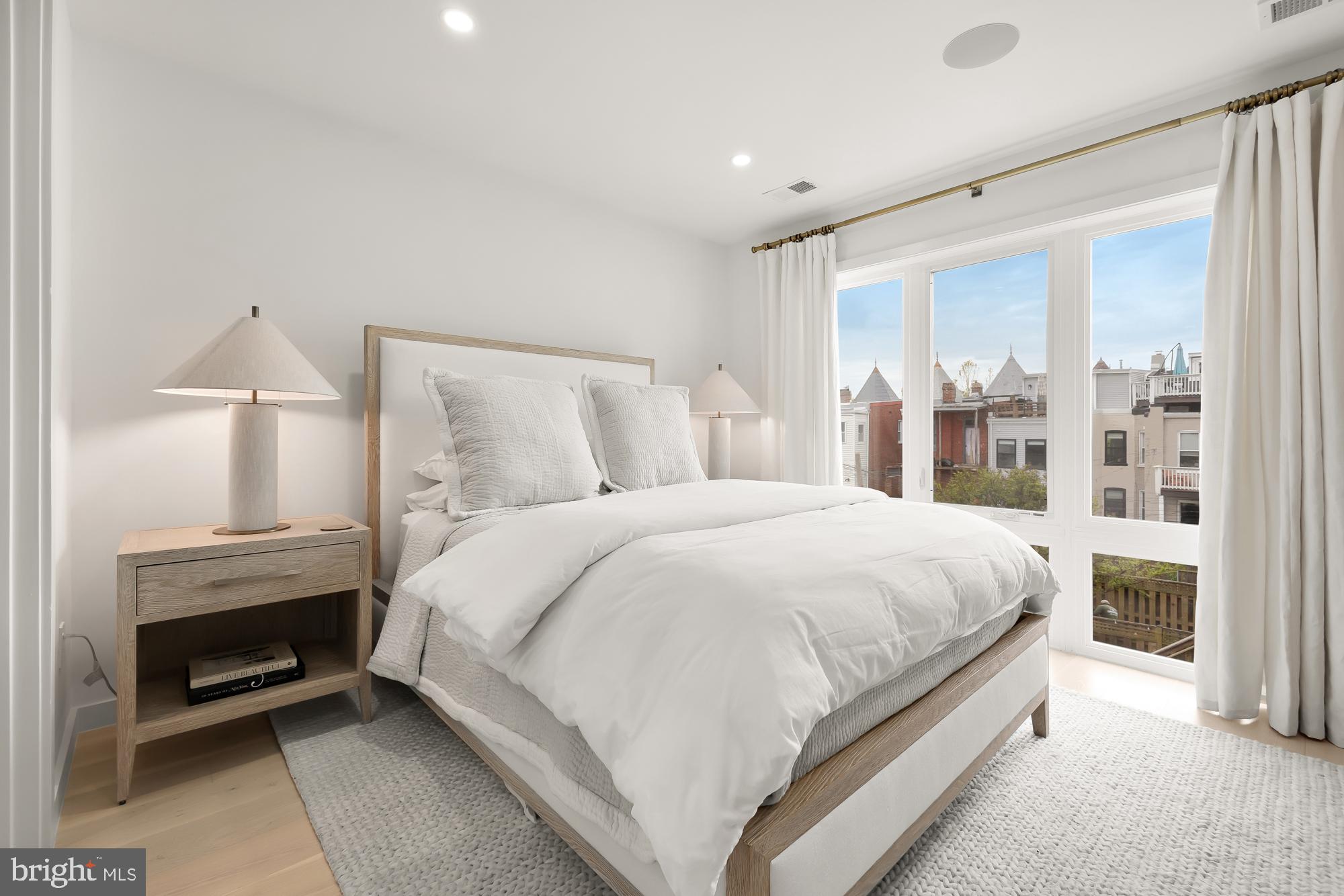 146 S Street Northwest, Unit B Washington, DC 20001 - Photo 26 of 51 a bed room with a bed and a night stand