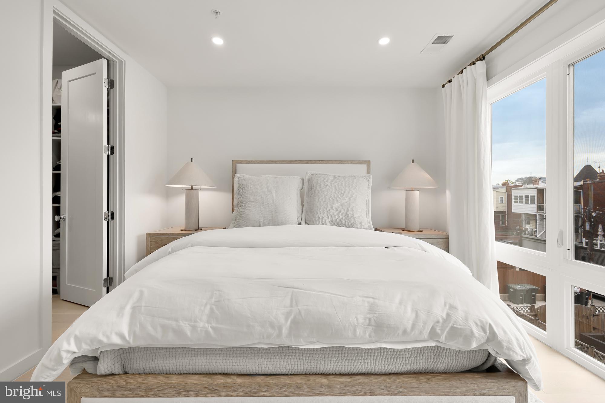 146 S Street Northwest, Unit B Washington, DC 20001 - Photo 27 of 51 a large white bed in a white room