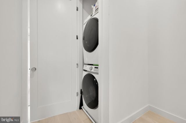 a large bed sitting in a room next to a window