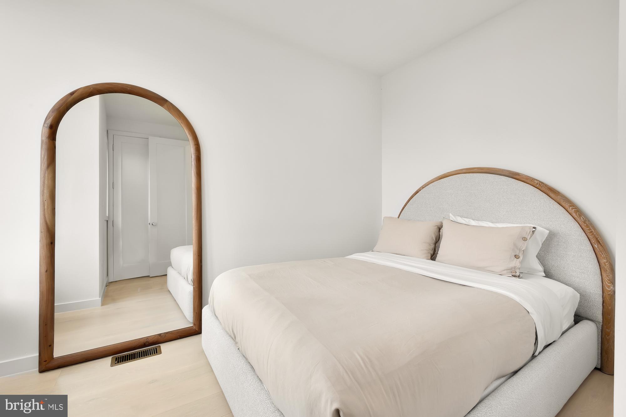 146 S Street Northwest, Unit B Washington, DC 20001 - Photo 33 of 51 a bedroom with a bed and a mirror