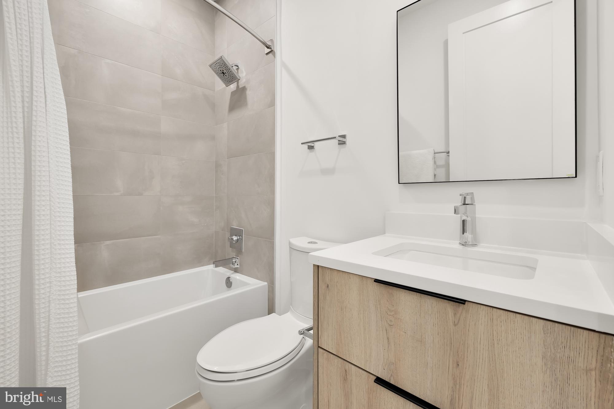 146 S Street Northwest, Unit B Washington, DC 20001 - Photo 36 of 51 a bathroom with a granite countertop sink toilet and shower