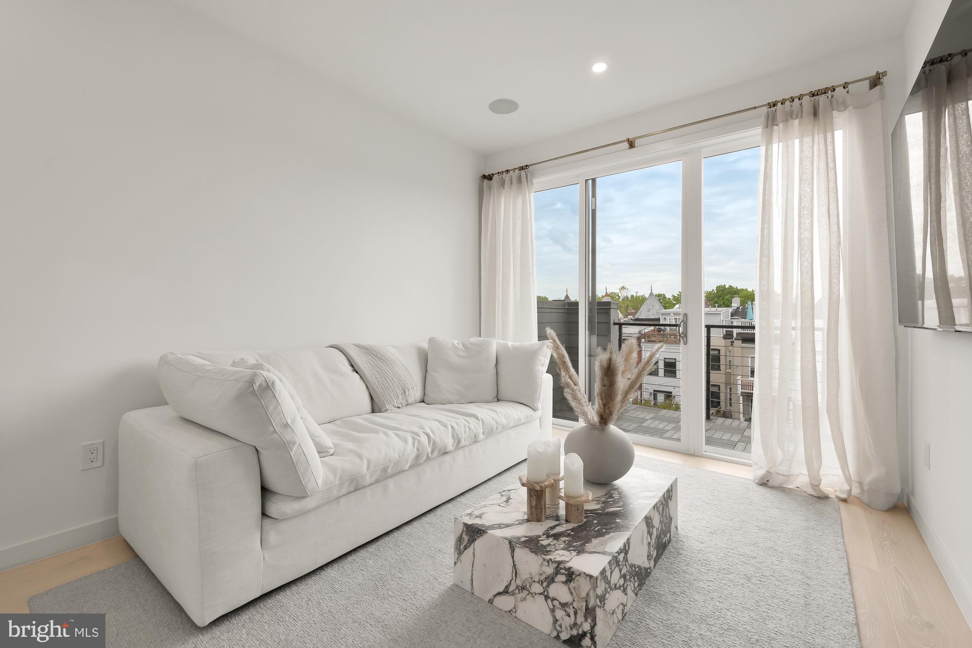 146 S Street Northwest, Unit B Washington, DC 20001 - Photo 37 of 51 a living room with furniture and large windows