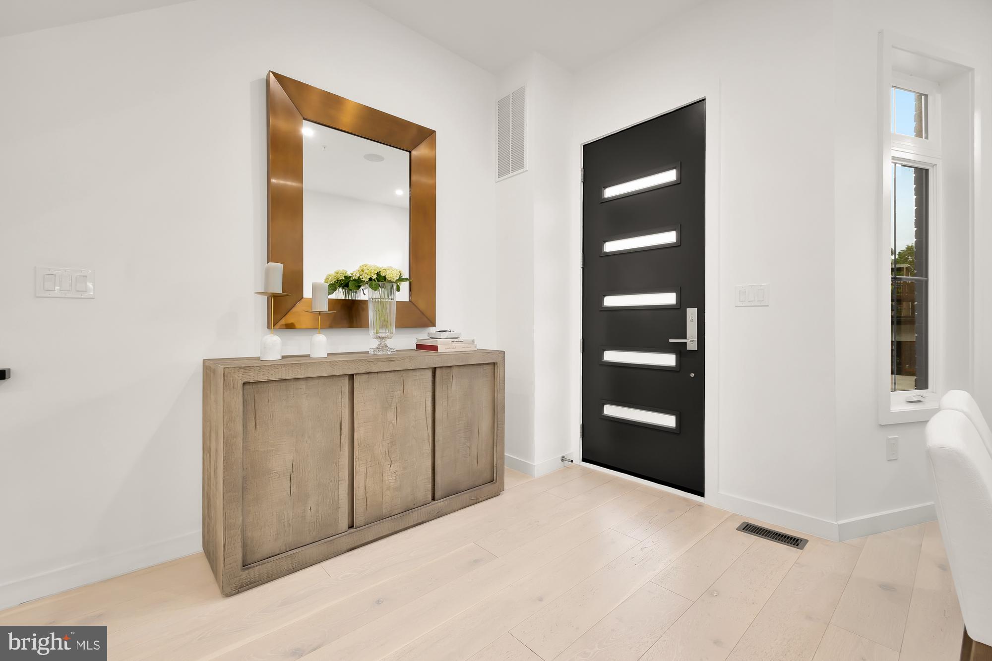 146 S Street Northwest, Unit B Washington, DC 20001 - Photo 4 of 51 a bathroom with a double vanity sink and a mirror