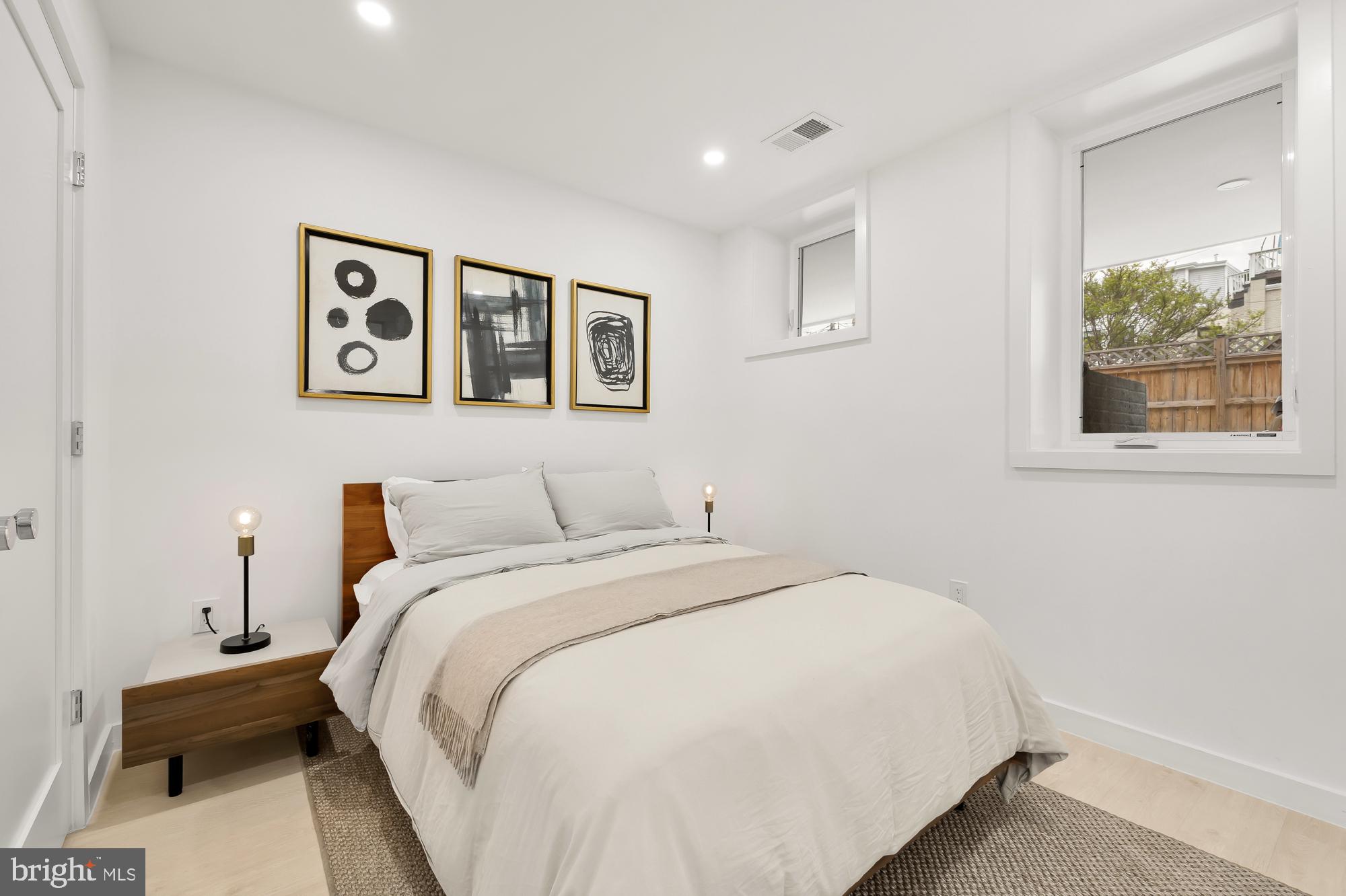 146 S Street Northwest, Unit B Washington, DC 20001 - Photo 43 of 51 a bedroom with a bed and a window