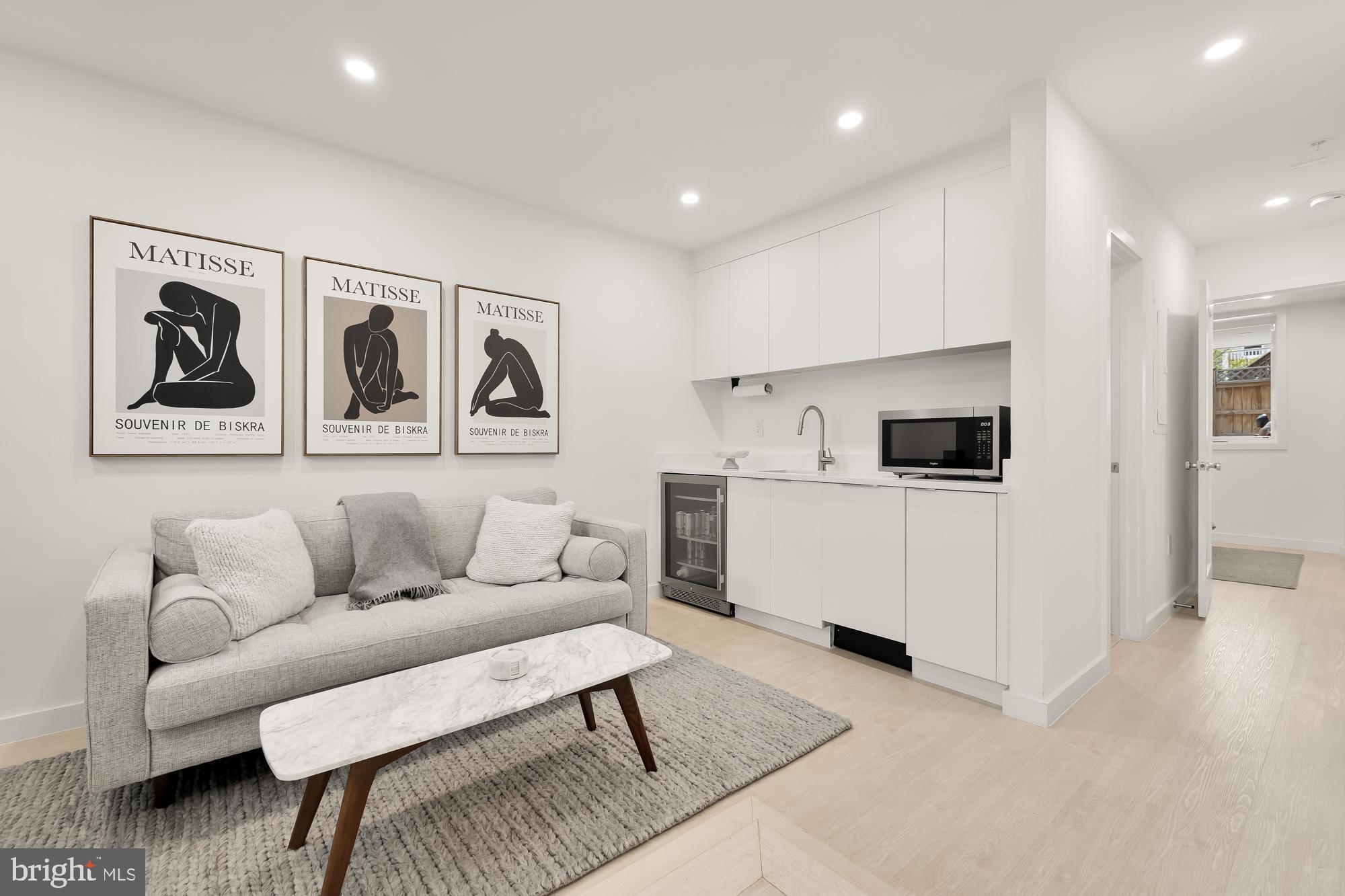 146 S Street Northwest, Unit B Washington, DC 20001 - Photo 47 of 51 a living room with furniture and kitchen view
