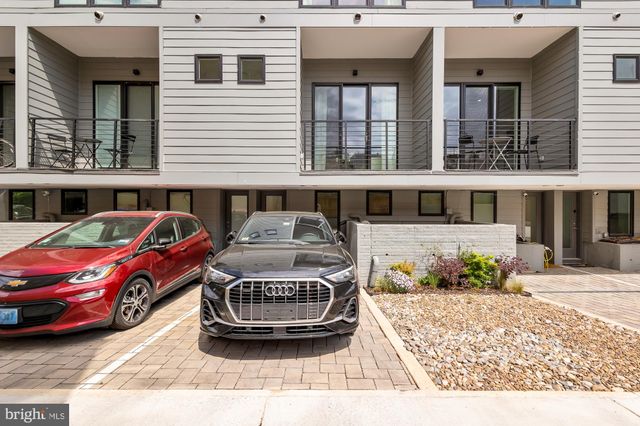 a black white and white photo of a refrigerator