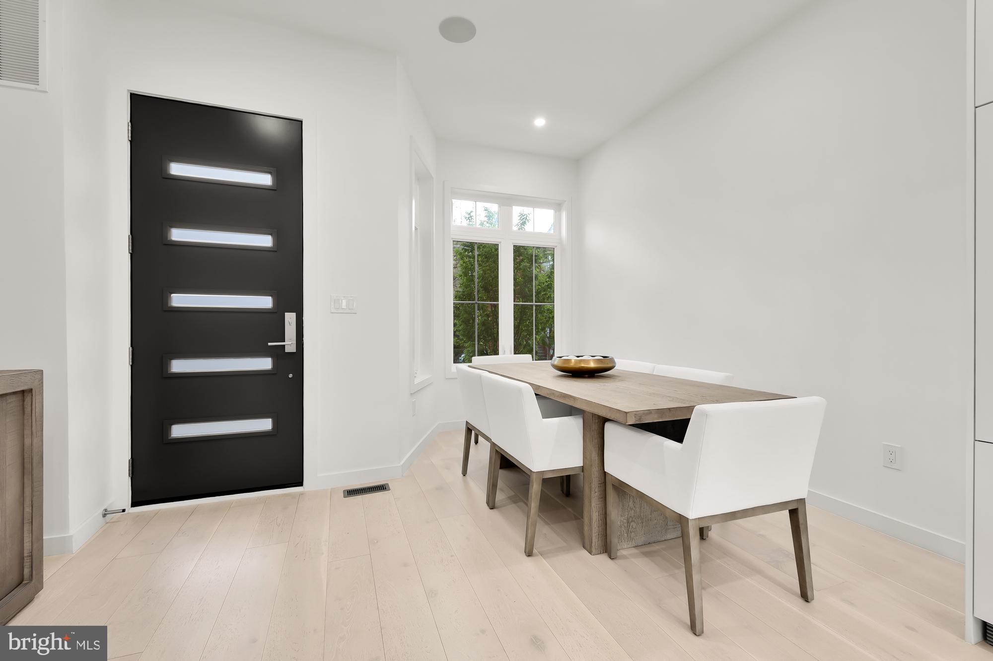146 S Street Northwest, Unit B Washington, DC 20001 - Photo 5 of 51 a view of a room that has a table and chair in it