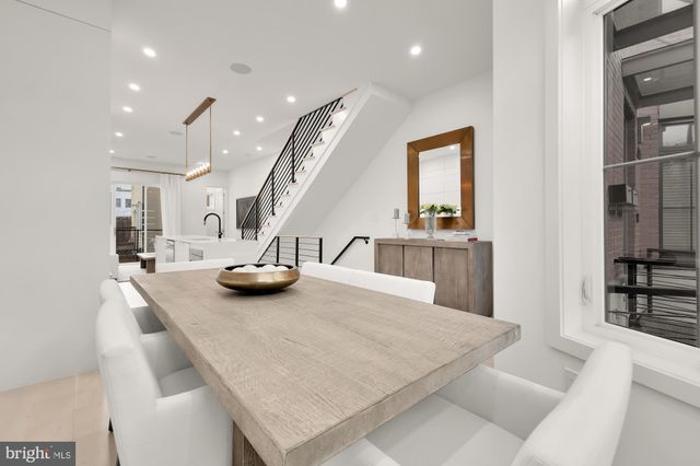 a kitchen with a sink a stove and cabinets