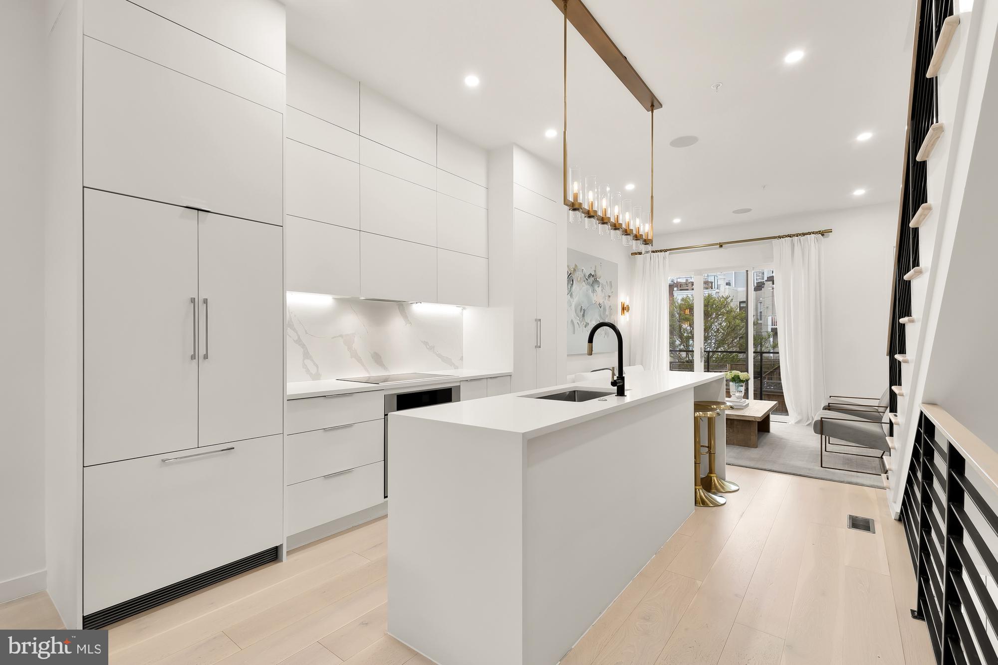 146 S Street Northwest, Unit B Washington, DC 20001 - Photo 8 of 51 a kitchen with a sink a stove and cabinets