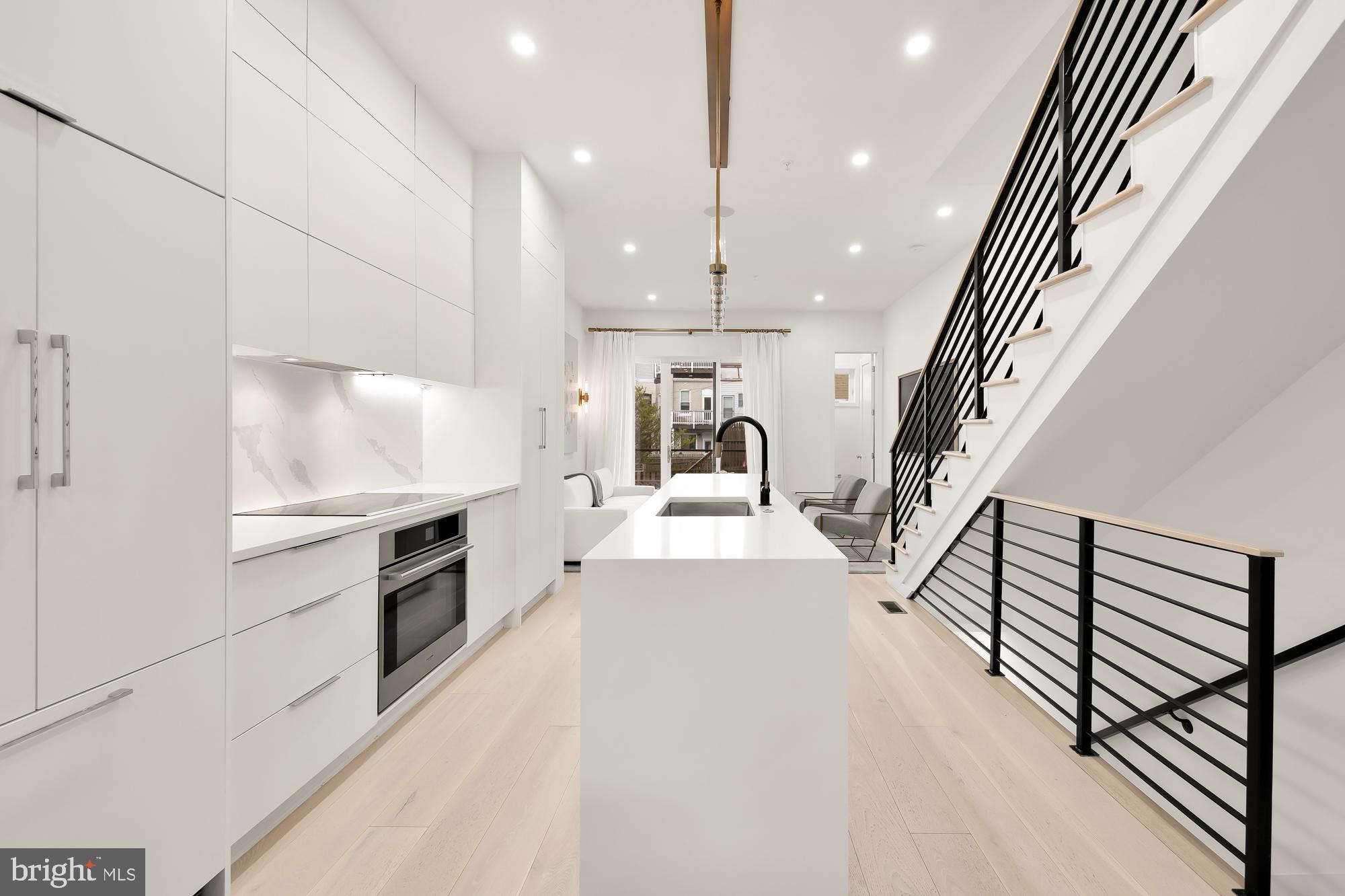146 S Street Northwest, Unit B Washington, DC 20001 - Photo 9 of 51 a view of kitchen with sink microwave and stove