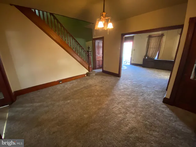 a view of a hallway with staircase