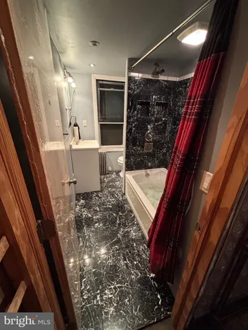 a bathroom with a sink and a shower