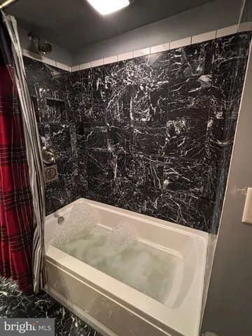 a bathroom with a bathtub