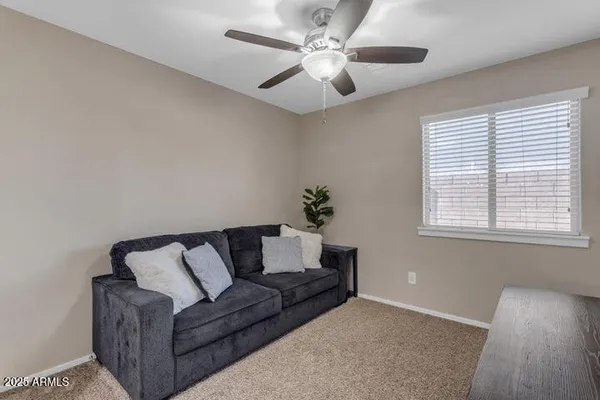 a living room with furniture and a window