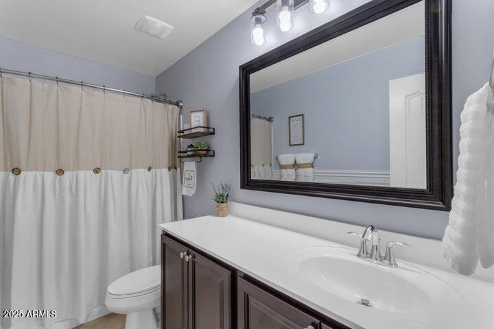 2220 East Stacey Road Gilbert, AZ 85298 - Photo 19 of 54 a bathroom with a sink and a mirror