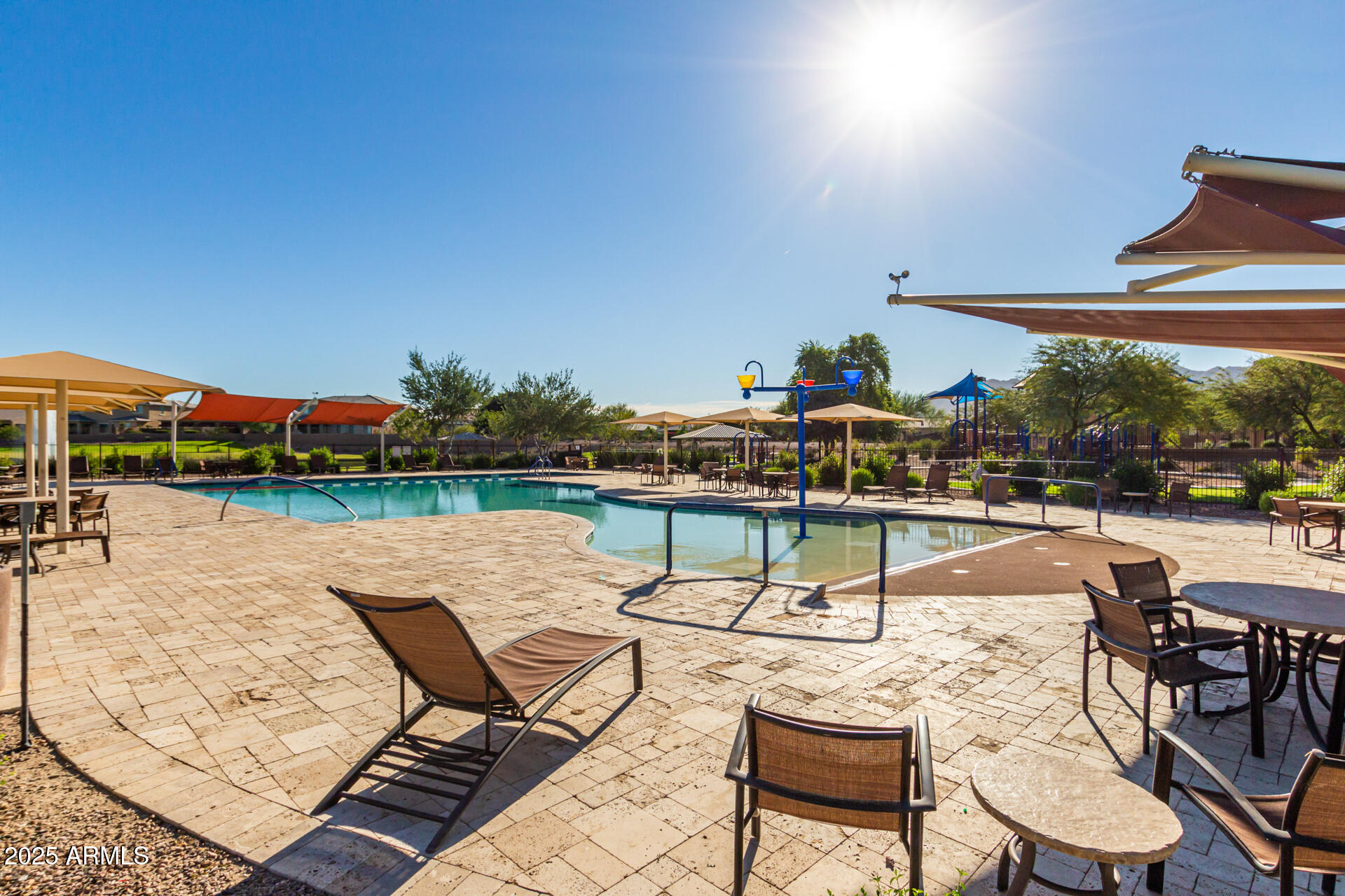 2220 East Stacey Road Gilbert, AZ 85298 - Photo 32 of 54 a swimming pool with outdoor seating and yard