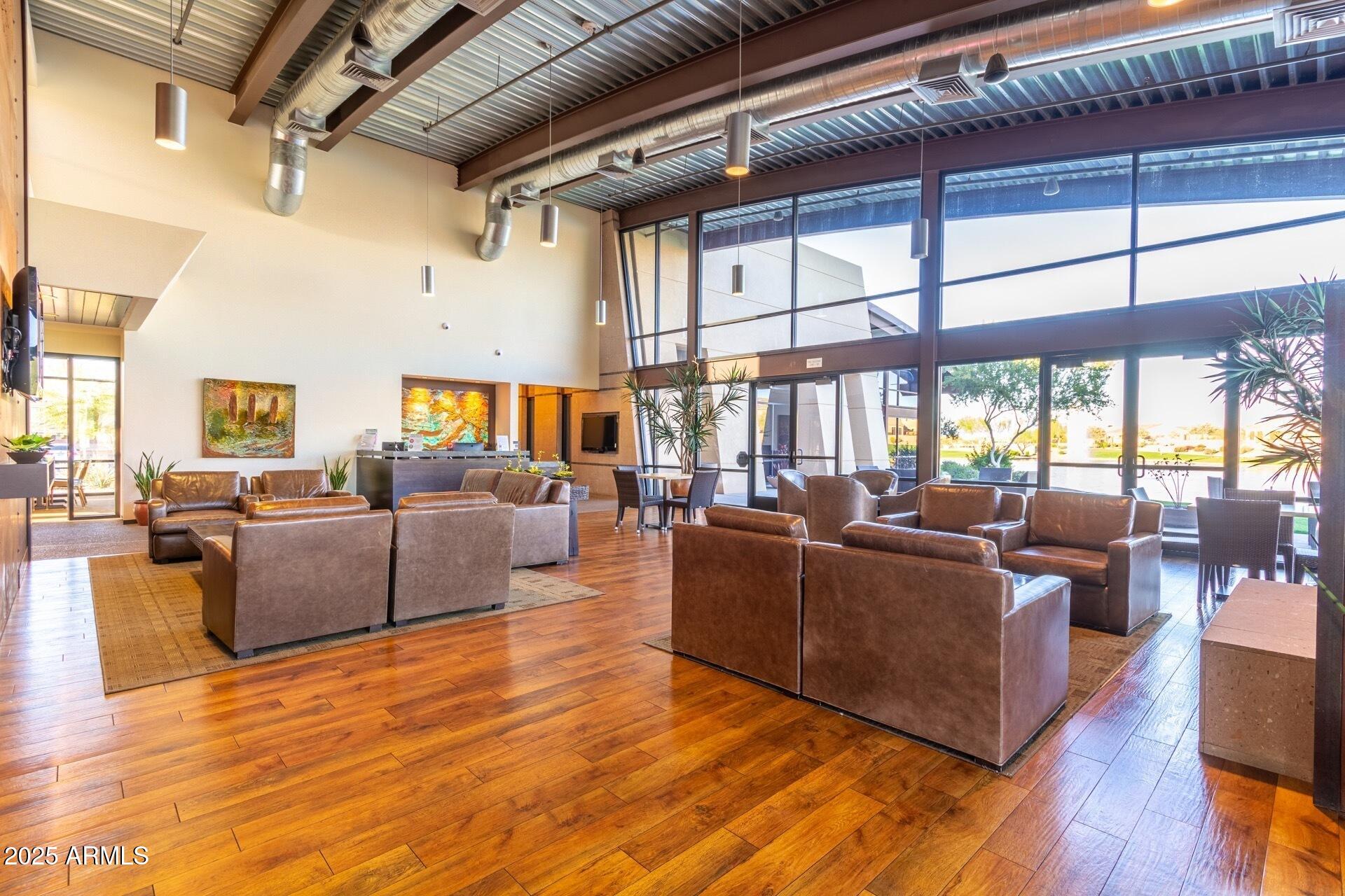 2220 East Stacey Road Gilbert, AZ 85298 - Photo 36 of 54 a living room with furniture or wooden floor and a large window