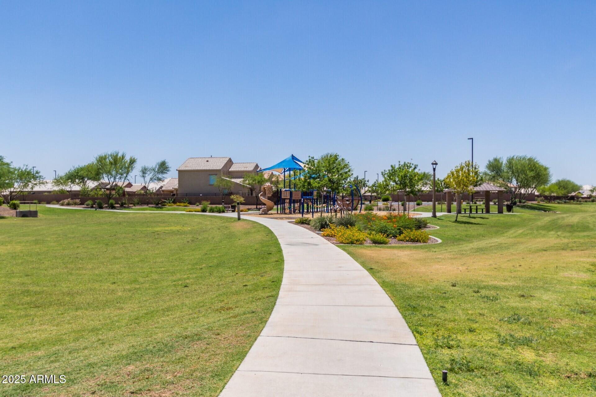 2220 East Stacey Road Gilbert, AZ 85298 - Photo 42 of 54 a view of swimming pool with a yard