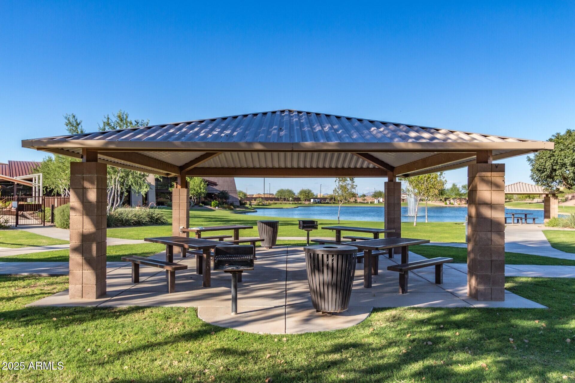 2220 East Stacey Road Gilbert, AZ 85298 - Photo 54 of 54 a view of a patio with a table chairs and a yard