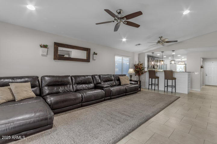 2220 East Stacey Road Gilbert, AZ 85298 - Photo 8 of 54 a living room with furniture and a ceiling fan